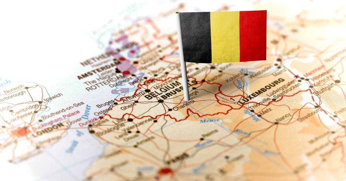 Close-up of Belgium on the map with the national flag pin.