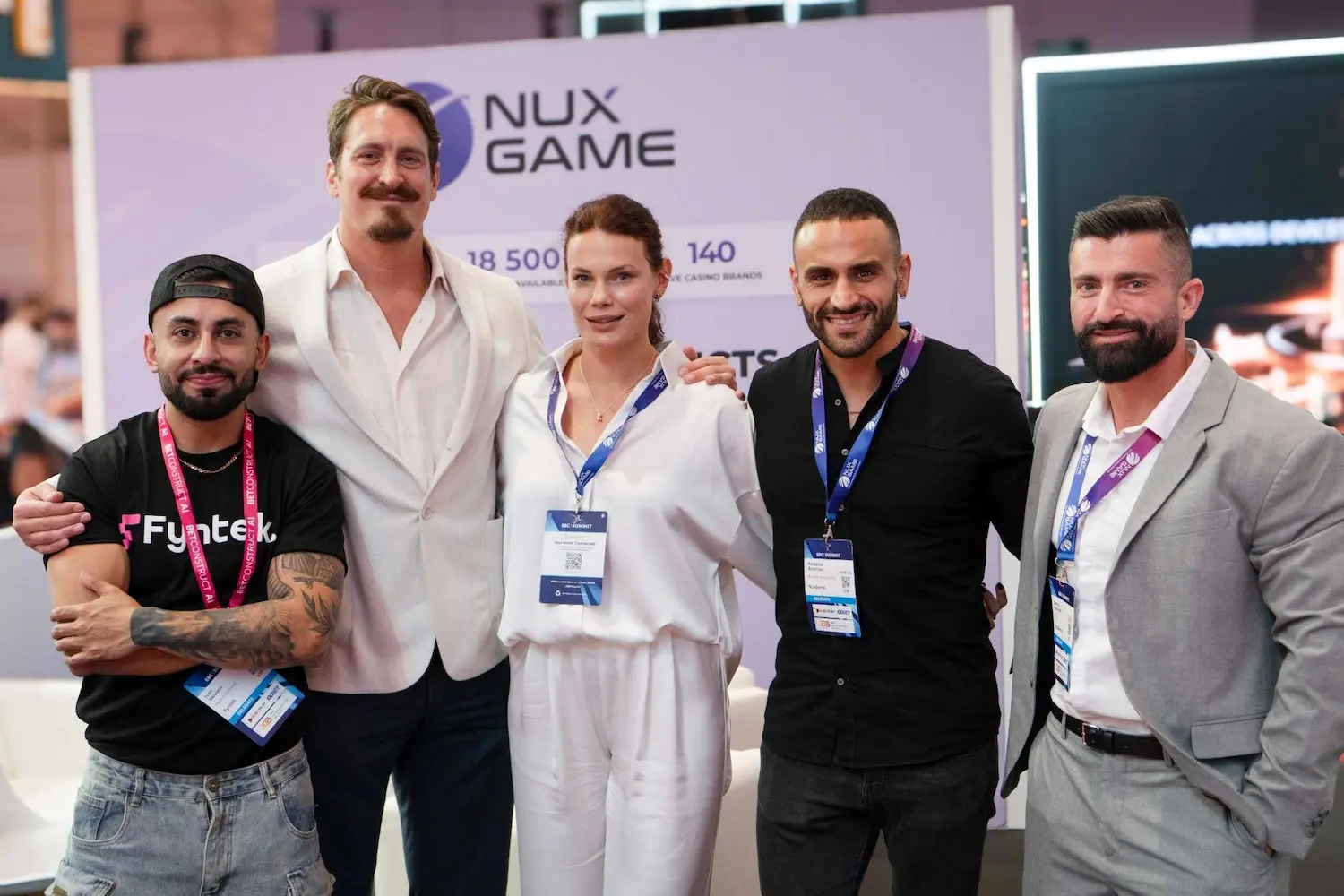 The NuxGame team with ecosystem partners on the show floor.
