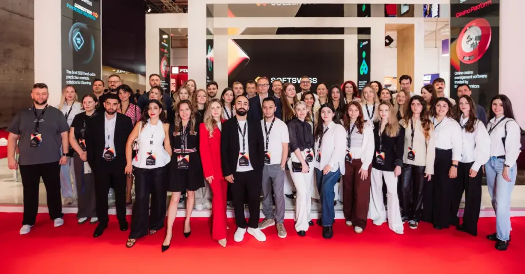 SOFTSWISS team poses at its exhibition stand during SBC Summit Lisbon 2026.